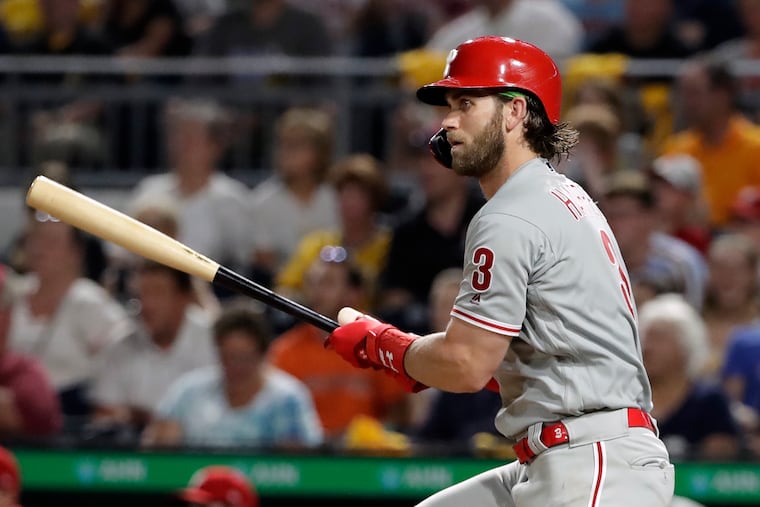 Philadelphia Phillies' Bryce Harper watches his RBI-single off Pittsburgh Pirates relief pitcher Richard Rodriguez during the seventh inning of a baseball game in Pittsburgh, Friday, July 19, 2019. (AP Photo/Gene J. Puskar)