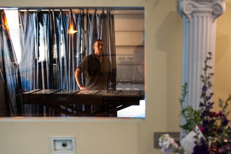 Families can observe the beginnings of the cremation process through a window in the chapel at Galzerano Funeral Home in Levittown. Robert Dzieniszewski, crematory operator, says that cremations take up to two and half hours. June 20, 2014. (MATTHEW HALL/Staff Photographer)