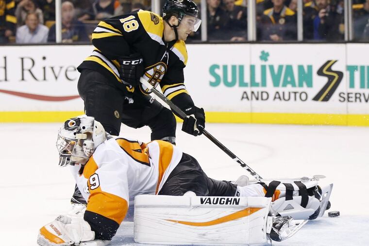 Kenny Agostino of the Bruins scores on Alex Lyon in overtime.