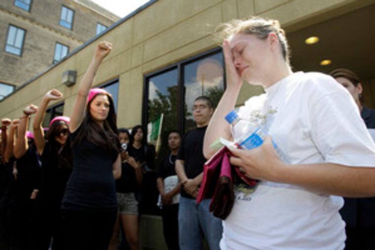 Crystal Dillman, fiancee of beating victim Luis Ramirez, is moved to tears as members of a group called Latina show support.