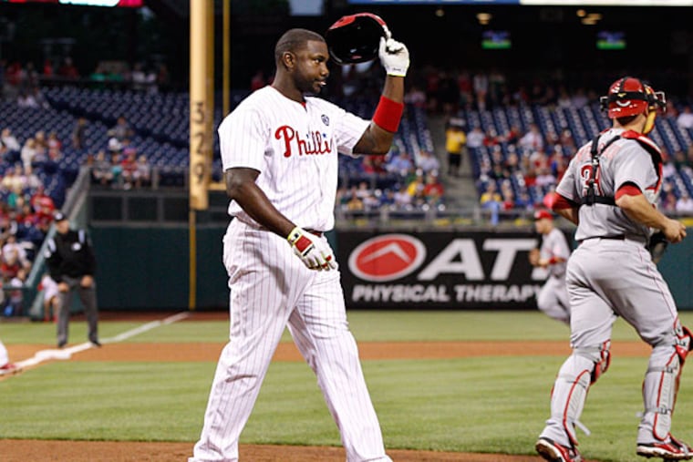Ryan Howard takes his helmet off after striking out to the third inning of a baseball game against the Cincinnati Reds, Friday, May 16, 2014, in Philadelphia. The Reds won 3-0. (Chris Szagola/AP)
