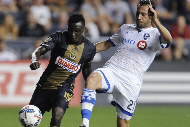 Union player Joshua Yaro (left) and the Montreal Impact’s Matteo Mancosu vie for the ball on Saturday.