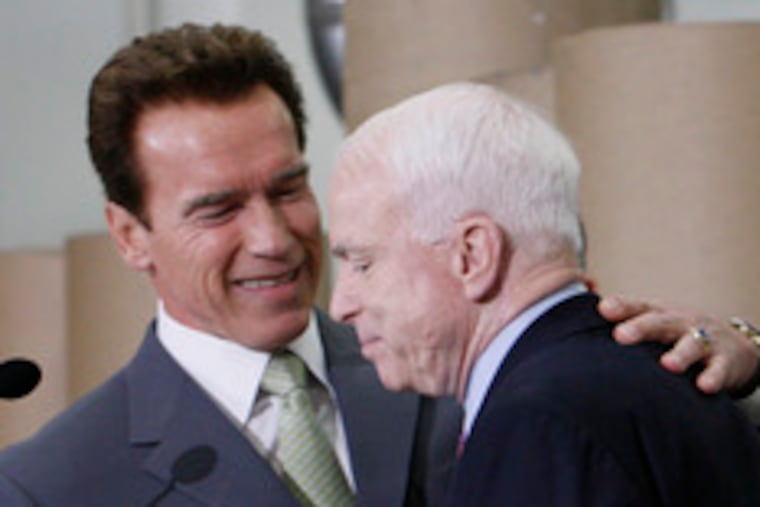 California Gov. Arnold Schwarzenegger shakes hands with Sen. John McCain, whom he endorsed in the GOP primary.