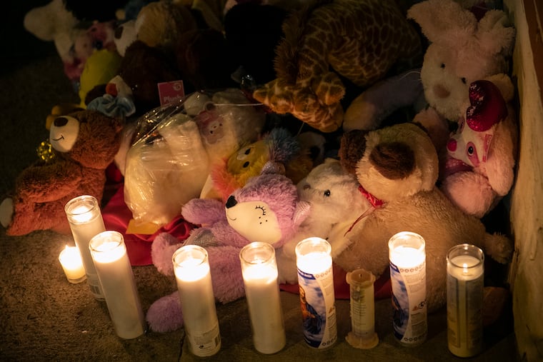 A memorial for the victims of the fatal fire by 23rd and Parrish is photographed in the Fairmount section of Philadelphia, on Thursday, Jan. 6, 2022. The fire killed 12 people, including eight children, early Wednesday morning.