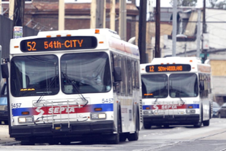 SEPTA buses along Woodland Avenue. Getting up-to-the-minute information on a smartphone about current bus schedules is one type of valuable data. (Yong Kim / Staff Photographer)