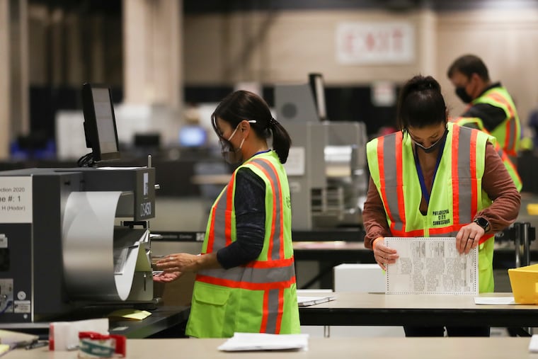 Ballots are counted inside the Pennsylvania Convention Center in Philadelphia on Election Day.