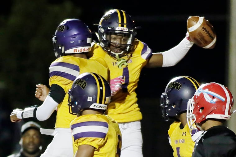 Camden senior Jajuan Hudson (No. 4, with football) celebrates his third touchdown in a 36-0 victory over Pennsauken.
