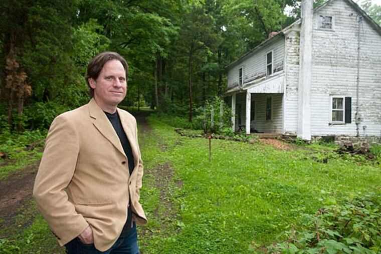 Todd Hilsee stands near his grandmother's house in Upper Pottsgrove Township. He was shocked to learn that a power company had cut down 189 trees on surrounding land. (Ron Tarver/Staff)