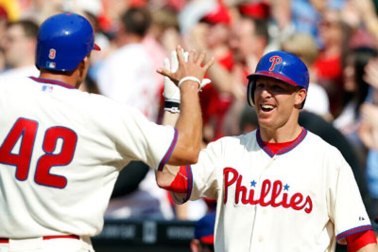Hunter Pence celebrates with Pete Orr after Pence scored as the Phillies took the
lead 3-2. (David Maialetti / Staff Photographer)