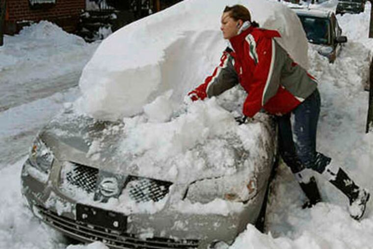 Remember this? Merissa Robitaille digs out her car after the December dumping. Looks like another big storm is on its way. (Michael S. Wirtz / Staff Photographer)