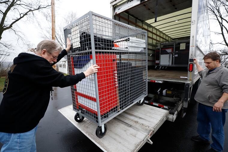Voting machines are collected from a polling place at Our Lady of Lourdes church in Wintersville, Ohio, Tuesday, March 17, 2020. Ohio's presidential primary was postponed Tuesday amid coronavirus concerns.