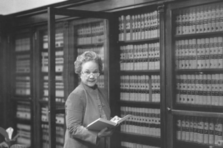 Judge Juanita Kidd Stout at a line of law books in her office. (File Photo)