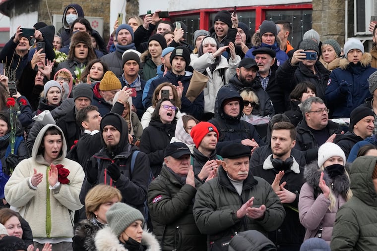 People gather outside the Church of the Icon of the Mother of God Soothe My Sorrows in Moscow. Relatives and supporters of Alexei Navalny are bidding farewell to the opposition leader at a funeral in southeastern Moscow, following a battle with authorities over the release of his body after his still-unexplained death in an Arctic penal colony.