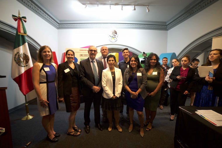 Carlos M. Sada (third from left), Mexican undersecretary for North America, and Alicia Kerber, Mexico’s consul in Philadelphia (center, white jacket), stand with American educators at an Aug. 15 announcement that the Mexican government is quadrupling money available for the IME Becas scholarship program. Also pictured (from left) are Joanne Woods, La Salle University; Marisa Pereyra, Immaculata University; Charlie Spencer, Cabrini University; Thor Kress, Cabrini University; Nina Soto, Millersville University; Brenda Reyes, Lincoln Intermediate Unit No. 12.