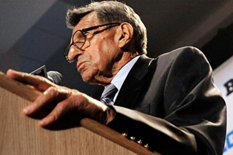 Penn State head coach Joe Paterno talks to reporters during Big Ten football media day on Thursday in Chicago. (Paul Beaty/AP)