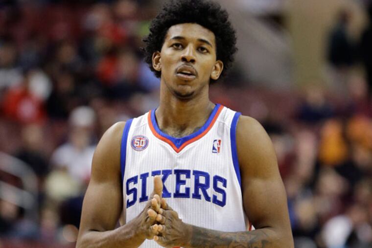 Nick Young watches during an NBA basketball game against the Toronto Raptors, Tuesday, Nov. 20, 2012, in Philadelphia. (Matt Slocum/AP file)