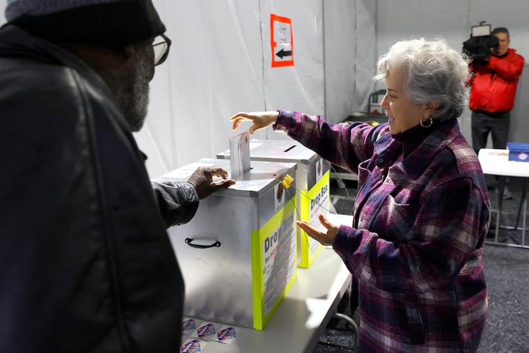 Martha Morris casts her ballot at a vote-by-mail drop box during primary voting in Las Vegas, on Tuesday, Feb. 6, 2024.