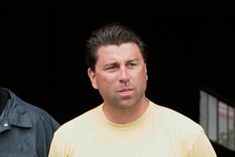 FILE - In this May 8, 2008 file photo Andrew Merola, of East Hanover, N.J., an alleged high ranking member of the Gambino crime family, is escorted from FBI offices in Newark, N.J. Merola faces a maximum prison sentence of 20 years after pleading guilty to one count of racketeering conspiracy in federal court in Newark on Tuesday Jan. 5, 2010. (AP Photo/Mike Derer, File)