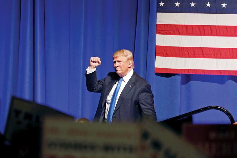 Republican presidential candidate Donald Trump raises his fist as he speaks during a campaign rally Monday, Nov. 7, 2016, in Scranton, Pa.