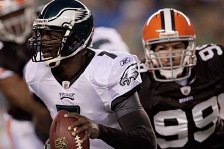 The Browns defensive line was able to get to Michael Vick early and often on Thursday. (David Maialetti/Staff Photographer)