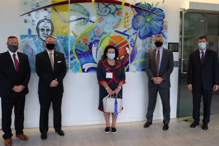 Her Majesty's Ambassador, Dame Karen Pierce (center) visited Almac's Souderton site in October and spoke with (from left) Mark Weir, vice president of finance, U.S.; Rich Segiel, vice president of business development, Almac Clinical Services; George Tiger, vice president of business development, Almac Clinical Technologies; and Mark Rohlfing, vice president of operations, Almac Clinical Services.