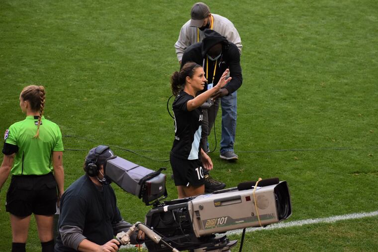 Carli Lloyd waves to the crowd after being substituted out of her final home game with Gotham FC on Sunday at Red Bull Arena.