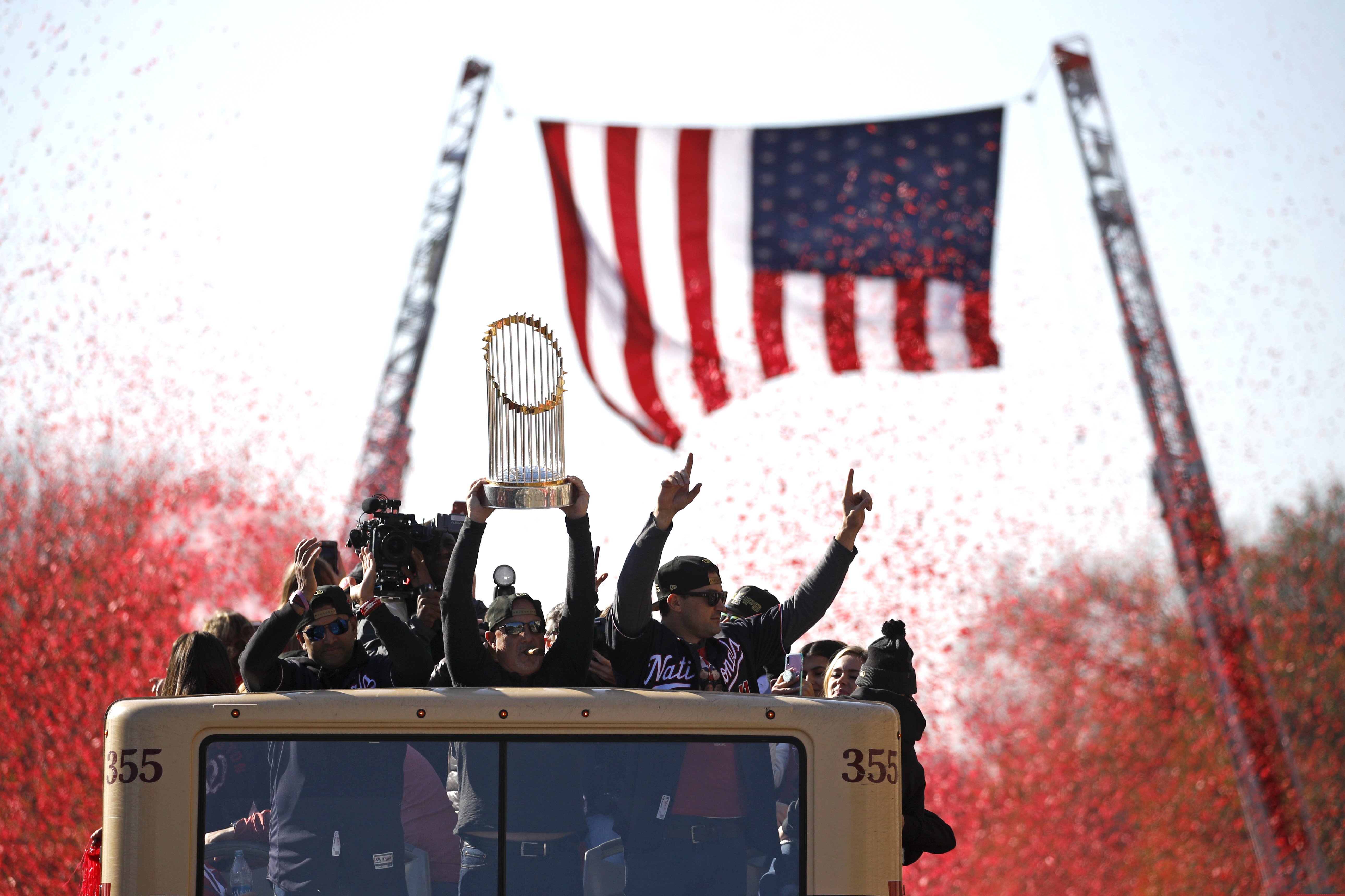 Washington Nationals general manager Mike Rizzo holds up the World Series trophy during a parade to celebrate the team's World Series baseball championship over the Houston Astros, Saturday, Nov. 2, 2019, in Washington.