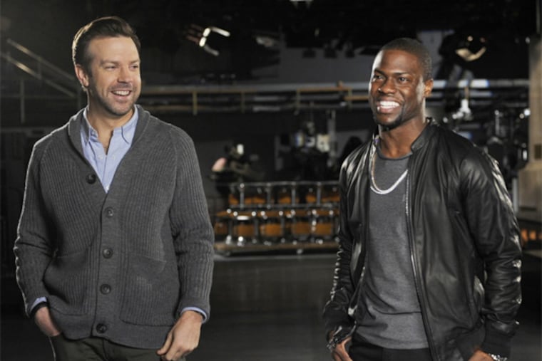 Cast member Jason Sudeikis, left, and guest host Kevin Hart during rehearsals for "Saturday Night Live," Two unpaid interns at Comcast Corp.-owned NBCUniversal, one with SNL and the other at the MSNBC cable-news channel, have filed a federal class-action lawsuit seeking at least $5 million. (AP Photo/NBC, Dana Edelson)