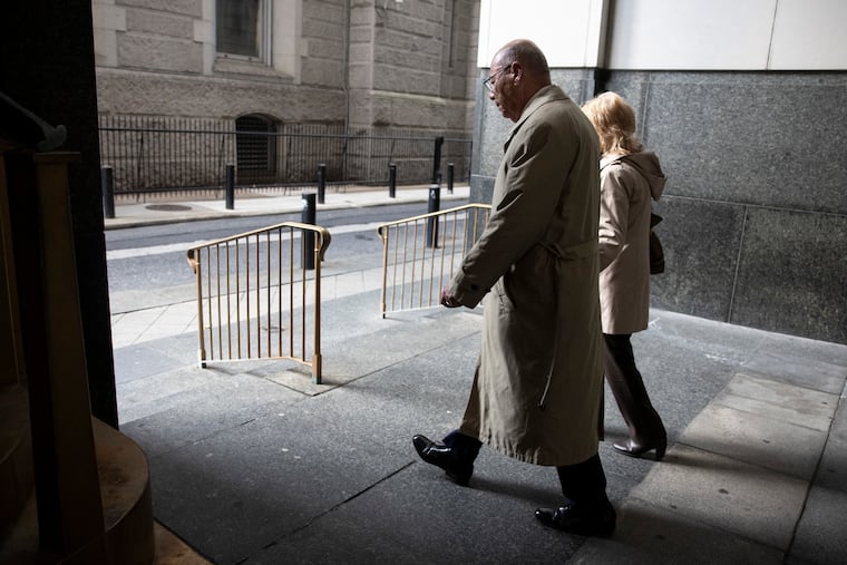 Manuel Santiago, center, leaves the Juanita Kidd Stout Center for Criminal Justice after the jury was released for the day on March 26, 2025 in Philadelphia.