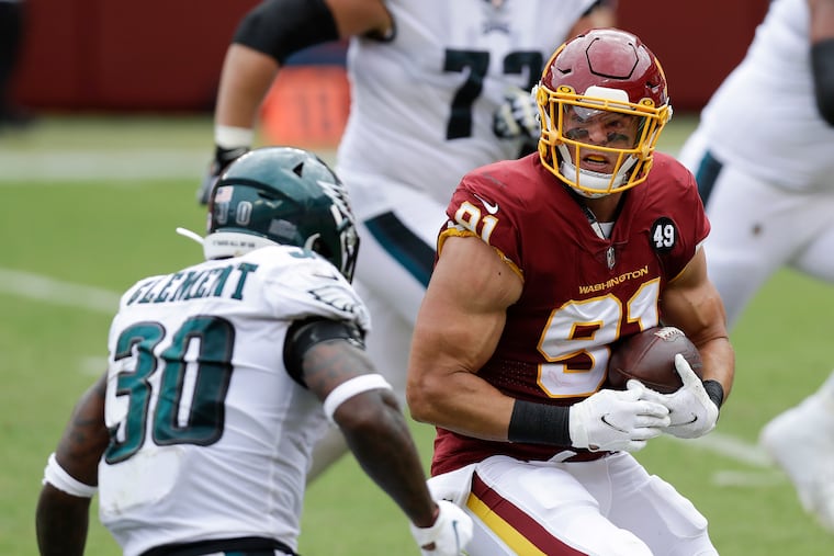 Washington Football Team defensive end Ryan Kerrigan running with the football after a fumble recovery against the Eagles in September.