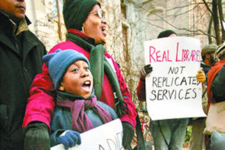 Isaiah Beaufort, 8, of Philadelphia, who uses the Overbrook library branch, which was targeted for closure, attends a protest at City Hall with his grandmother Betty Beaufort.
