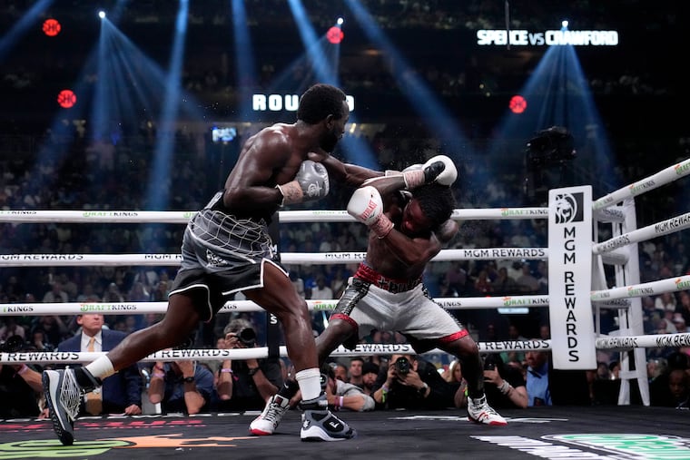 Terence Crawford, left, and Errol Spence Jr. fight during their undisputed welterweight championship boxing match, Saturday, July 29, 2023, in Las Vegas.
