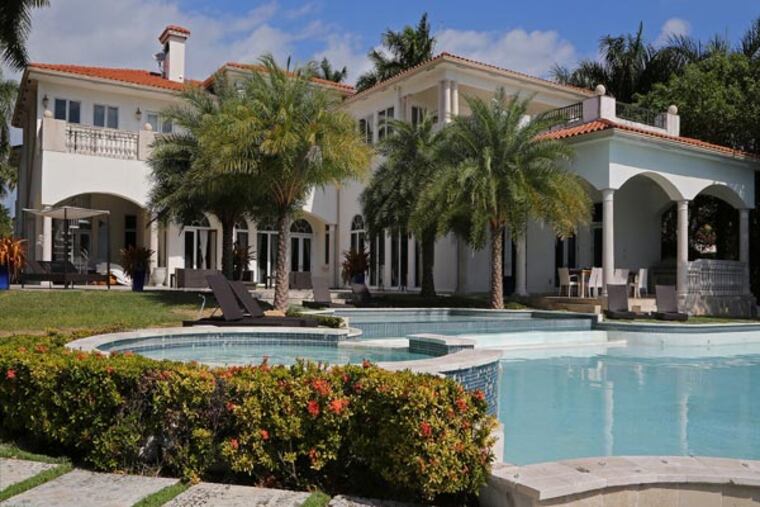 This is the rear exterior of a Palm Island, Florida, mansion that is currently listing. Luxury home broker, Mark Zilbert, toured the property that is up for sale for $23.4 million on February 5, 2013. "Every building we do business in is at its highest price of all time," Zilbert said. (Carl Juste/Miami Herald/MCT)