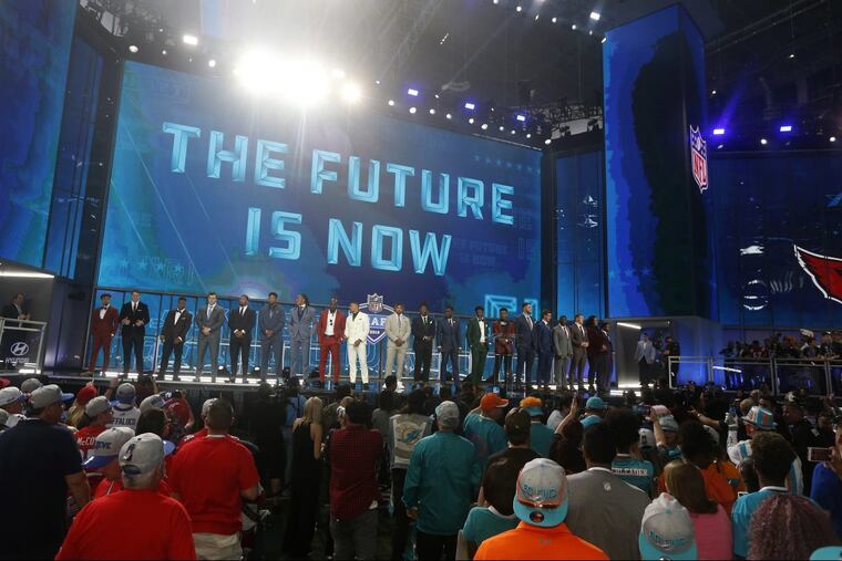 Prospects in attendance stand on stage at the start of the first round of the NFL football draft, Thursday, April 26, 2018, in Arlington, Texas.