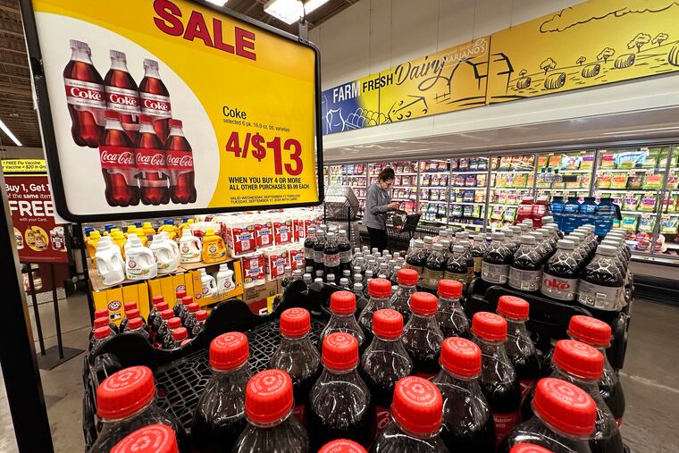A customer passes an array of beverages while shopping at a grocery store in Chicago Sept. 19, 2024.
