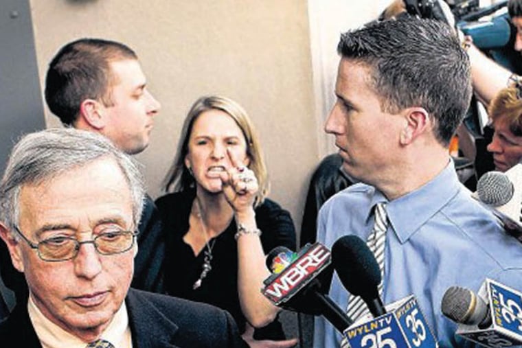 Sandy Fonzo yells at Judge Mark Ciavarella as he leaves court in 2011. Fonzo’s son, Ed, committed suicide after his release from prison.