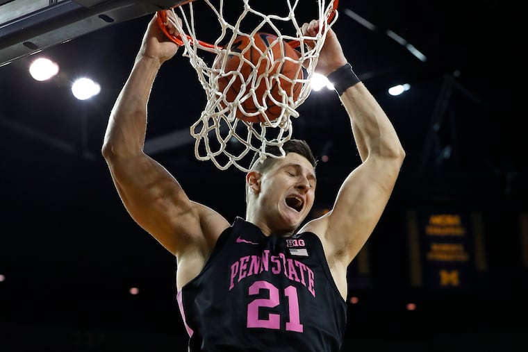 Penn State forward John Harrar (21) dunks against Michigan in the first half of an NCAA college basketball game in Ann Arbor, Mich., in January.