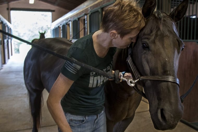 Shannon Revit, 49, a nurse practitioner from Warrington, with therapy horse Ebony.