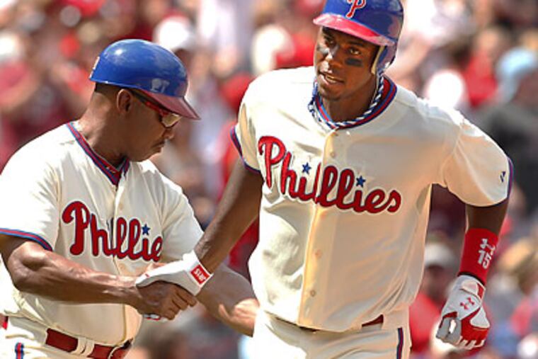 John Mayberry Jr. (right) hit two home runs in Sunday's win over the Giants. (Ron Cortes/Staff Photographer)