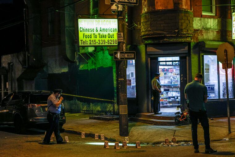 Philadelphia police on the scene at 27th and Dickinson streets in the Gray's Ferry section of the city, where five people were shot at a Chinese restaurant at about 10:30 Monday night. More than 40 shell casings were found at the scene.
