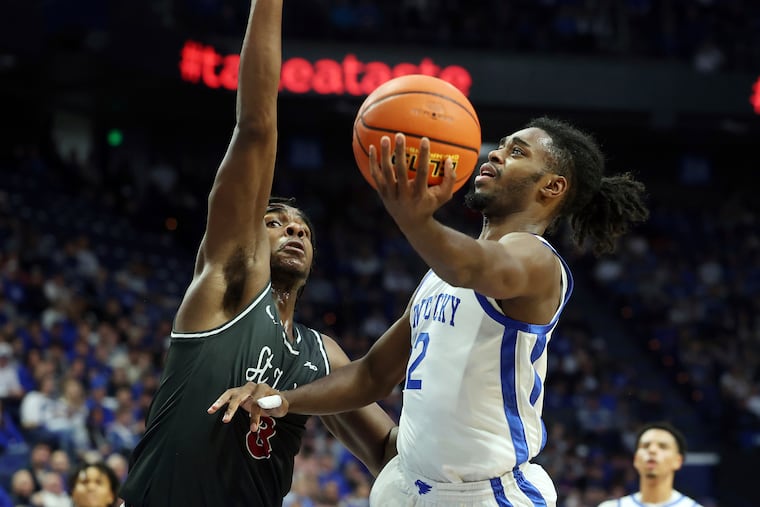 Saint Joseph's Cameron Brown (3) seen here in action last week against Kentucky, led the Hawks with a 16-point outing to get a win Sunday over Sacred Heart.