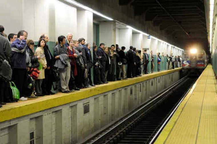 At Suburban Station, a long line of commuters waits for the next Regional Rail train during the last SEPTA strike on Nov. 4, 2009. Upstairs, many waited in long lines for platform access. (KRISTON J. BETHEL / Staff Photographer)