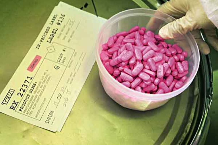 TEVA22 Philadelphia Inquirer Photograph by Dan Z. Johnson. Shoot date: Tue 9/14/2004 10:00:00 AM Location: Teva Pharmaceuticals USA, Sellersville, Bucks County, PA
IN THIS PHOTO: l/r KEVIN SCHAFFER a Pharmacy Group Leader at teva for the past 8 years, checks generic Darvocet tablets in a coating machine that adds a pink layer to the outside.
3of4