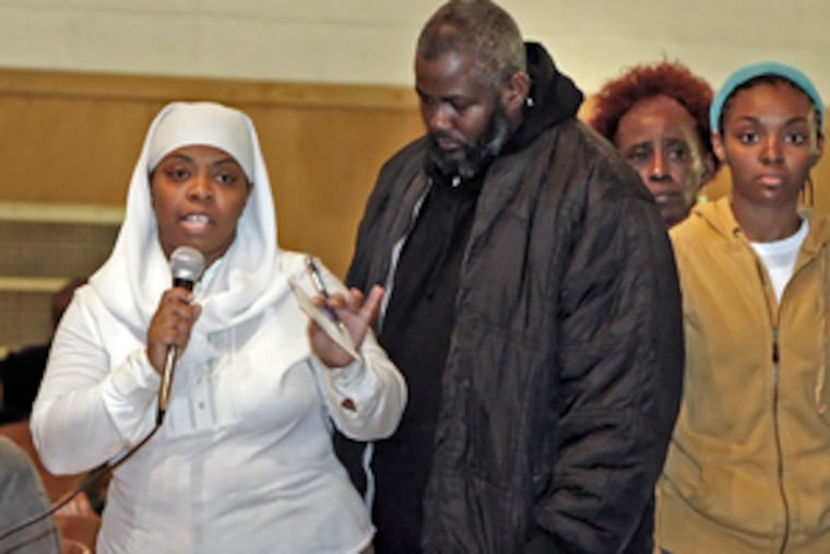 Pamela Goode, mother of Timothy Goode, who was shot and killed by police in Germantown, with family members at a recent community meeting held by new Philadelphia Police Commissioner Charles H. Ramsey.