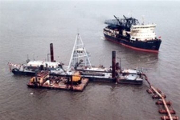 The McFarland approaches the discharge barge.