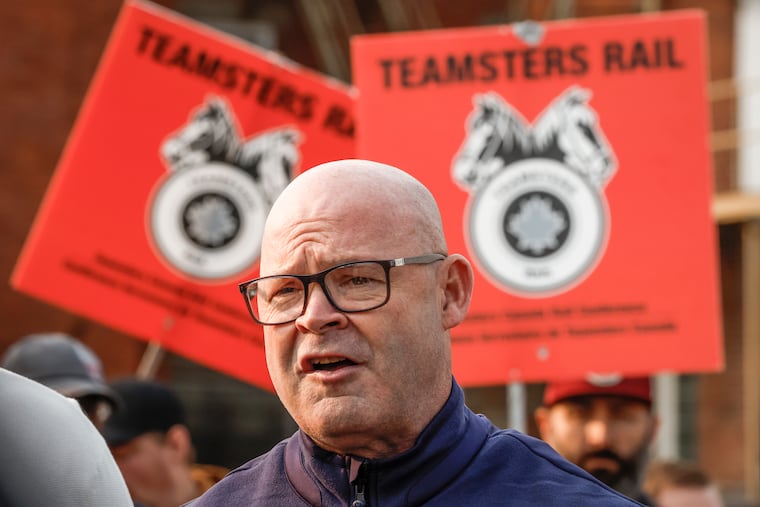 Sean O'Brien, General President, International Brotherhood of Teamsters, speaks to media as picketing rail workers gather at the CPKC headquarters in Calgary, Alta., in August.