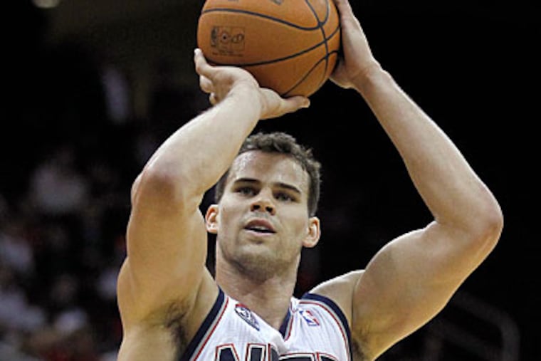 The problem with bidding for Kris Humphries is that the team that signs him will likely overpay. (Julio Cortez/AP)