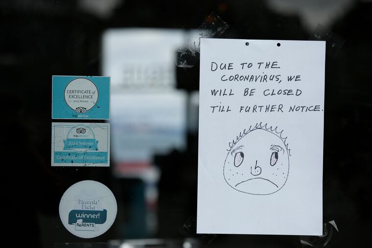 A closed sign is posted to the entrance of the Musée Mécanique penny arcade at Fisherman's Wharf Monday, March 16, 2020, in San Francisco. Officials in six San Francisco Bay Area counties issued a shelter-in-place mandate Monday affecting nearly 7 million people, including the city of San Francisco itself. The order says residents must stay inside and venture out only for necessities for three weeks starting Tuesday in a desperate attempt by officials to curb the spread of the novel coronavirus.