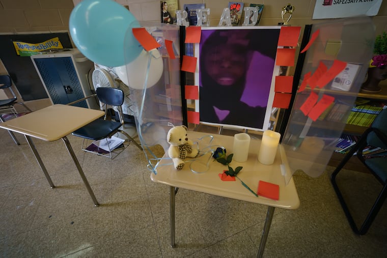 A memorial to Marcus, who was shot and killed earlier this month, was set up in his classroom at E.W. Rhodes Middle School on Oct. 14. Police obtained an arrest warrant for a 29-year-old man they say is responsible for his death.