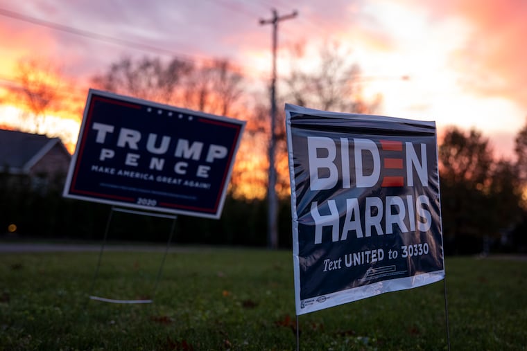Trump-Pence and Biden-Harris campaign signs on Election Day in Doylestown.